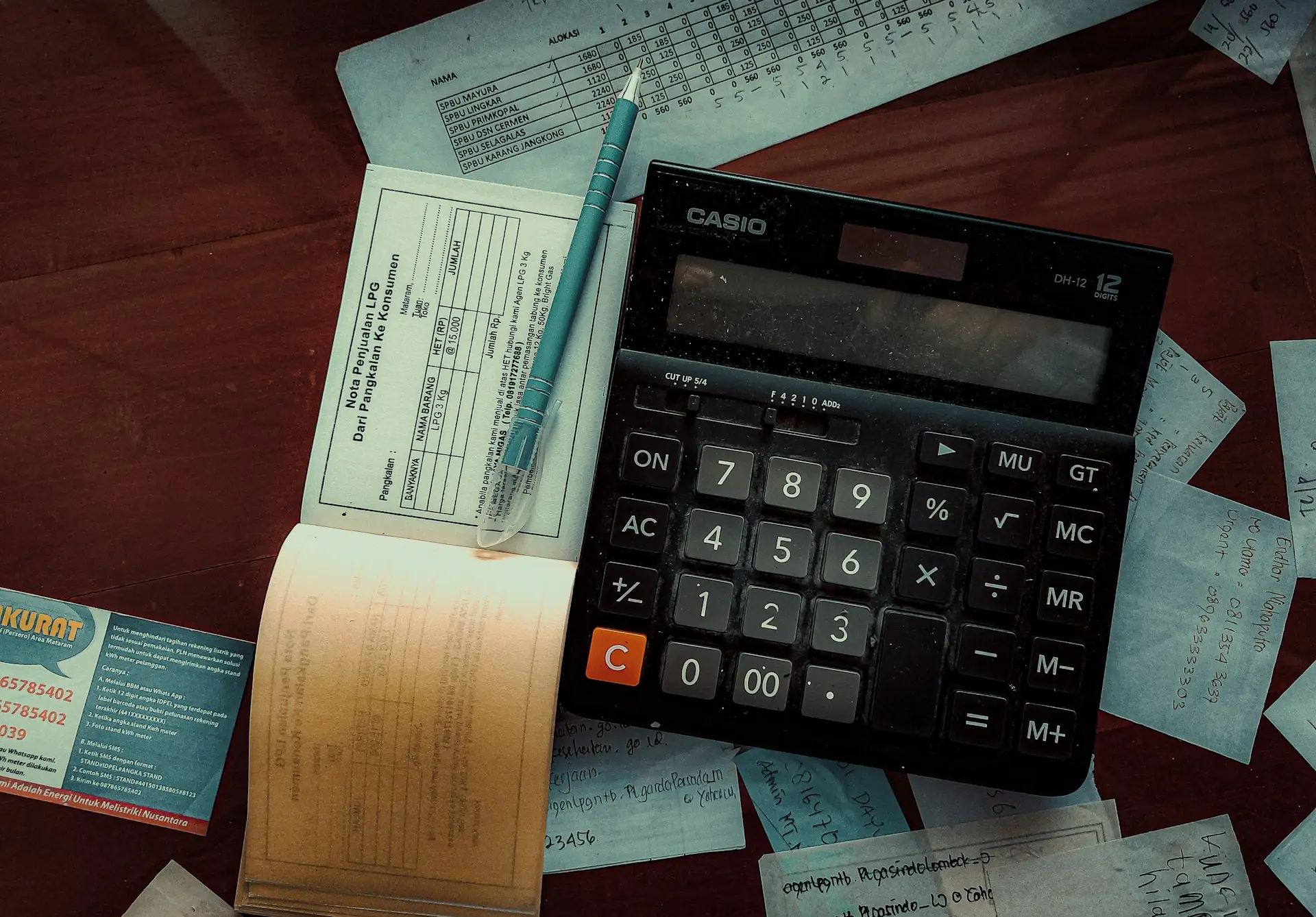 a calculator sitting on top of a wooden table